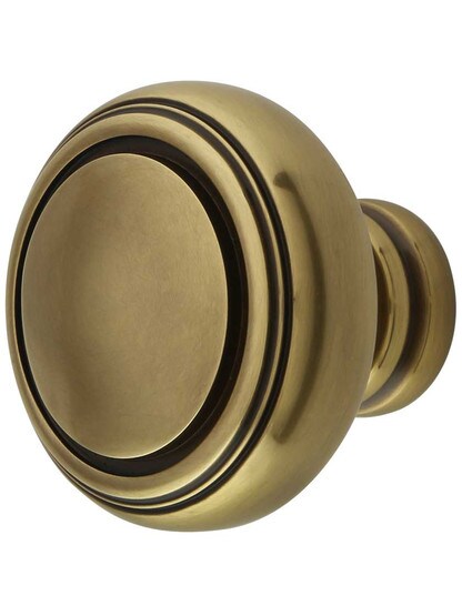 Norwich Cabinet Knob - 1 5/8 inch Diameter in Antique Brass.